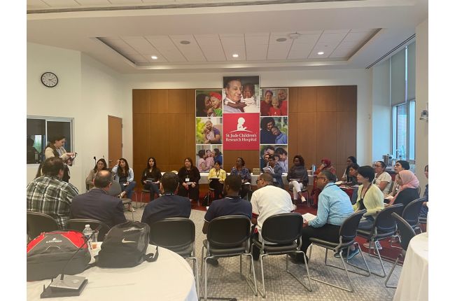 Multiple St. Jude representatives sitting in a collaborative setting.