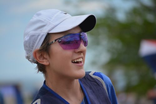 Emily wearing a baseball cap and sunglasses at Olympic Shooting Center