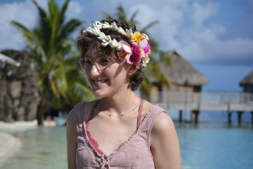 Emily with flowers in her hair on Moorea Island