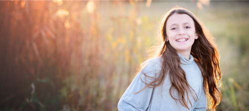 Image of child running through a field