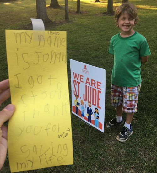 Eight-year-old Jonah McCoy and his family delivered thank you notes by spotting the “We are St. Jude” signs in employees’ yards.