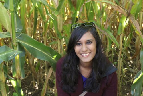Rahela Aziz-Bose standing in a corn field