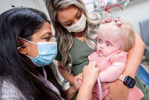 Aditi Bagchi, MD, PhD, with patient and mom