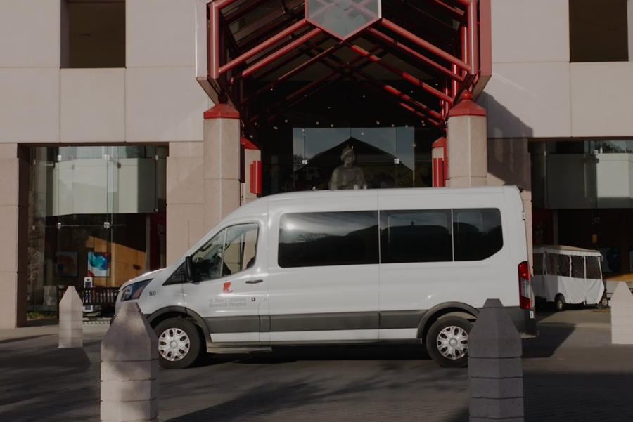 St. Jude shuttle van parked outside building