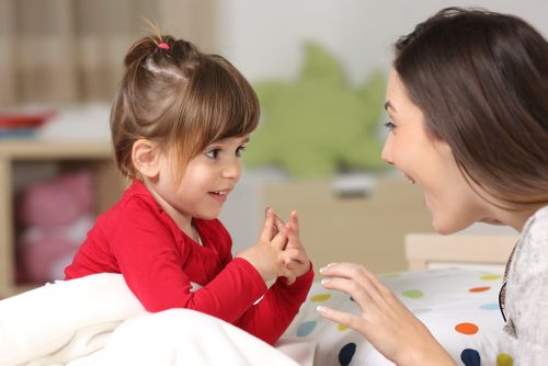 Toddler playing with caregiver