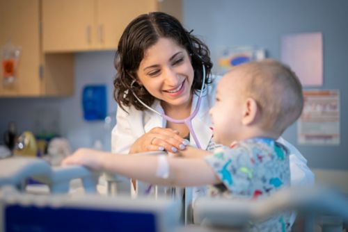 Dr. Asya Agulnik with childhood cancer patient