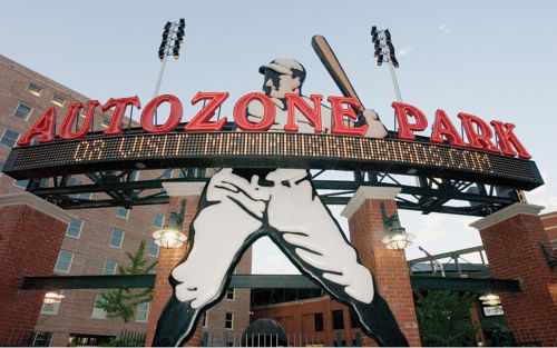 photo of entrance to baseball park with large sculpture of batter