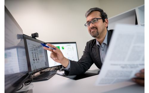 photo of Madan Babu at computers