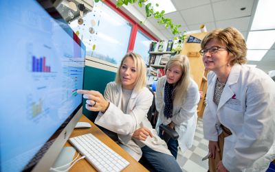 photo of Suzanne Baker with grad students