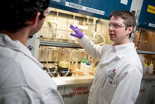 Daniel Blair, PhD, illustrates a concept in his laboratory.