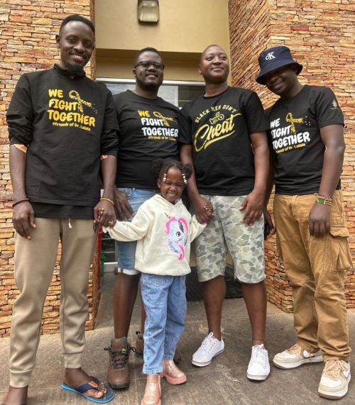 Kenneth and his daughter Gabriella with several blood donors