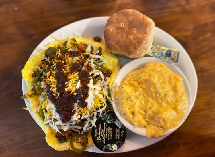 Plated meal of eggs, grits and a biscuit at Brother Juniper's restaurant in Memphis.