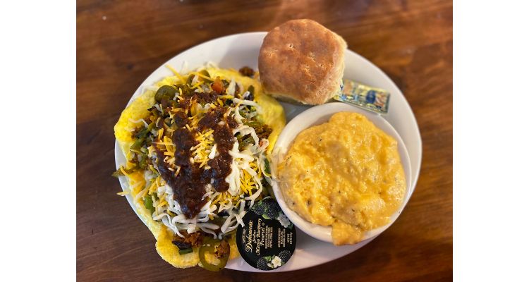 Plated meal of eggs, grits and a biscuit at Brother Juniper's restaurant in Memphis.