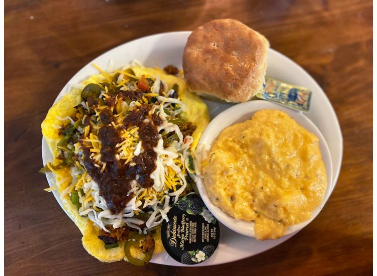 Plated meal of eggs, grits and a biscuit at Brother Juniper's restaurant in Memphis.