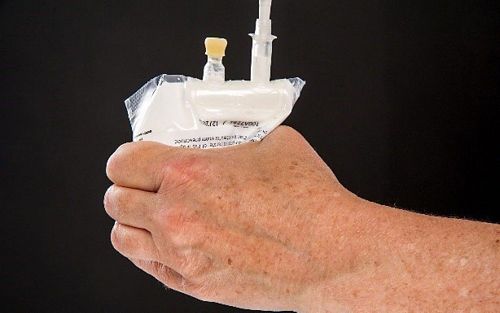 Person squeezing air from bag