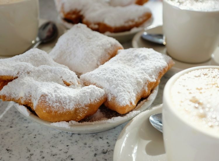 Beignets covered in powdered sugar.