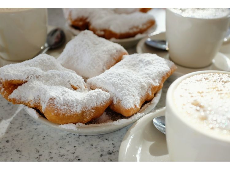 Beignets covered in powdered sugar.