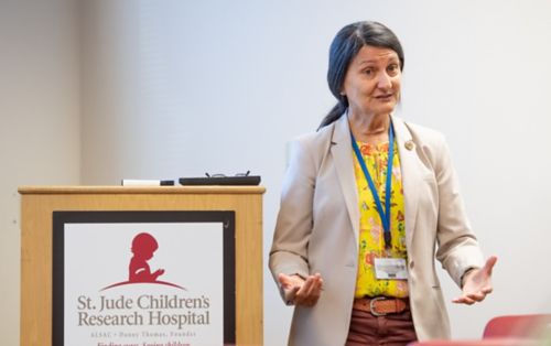 Faculty member Miguela Caniza MD, MPH, in classroom during orientation