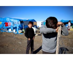 Sad child in refugee camp