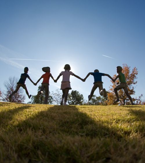 Statue of children running and playing