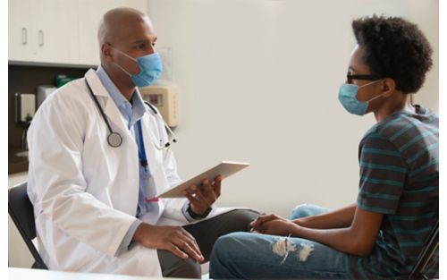 Doctor consults with male patient