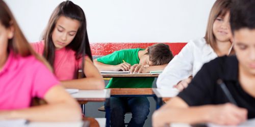 Image of boy sleeping in class