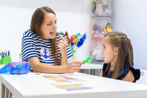 A speech-language pathologist speaking to a child