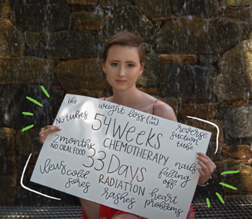 Elizabeth holding a sign that says "54 weeks of chemotherapy, 33 days of radiation."