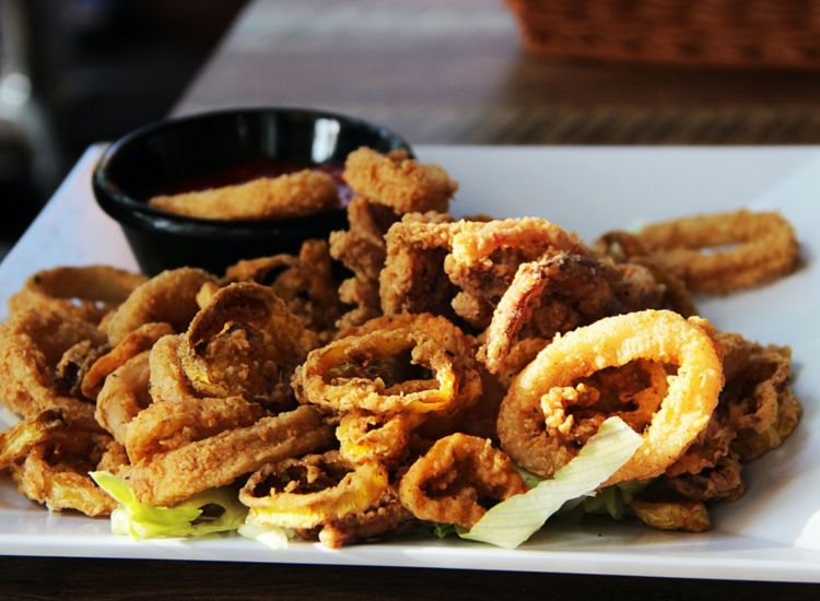 Photo of a plate full of fried calamari