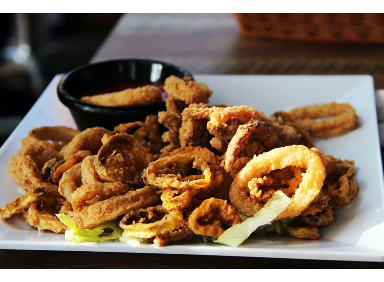 Photo of a plate full of fried calamari