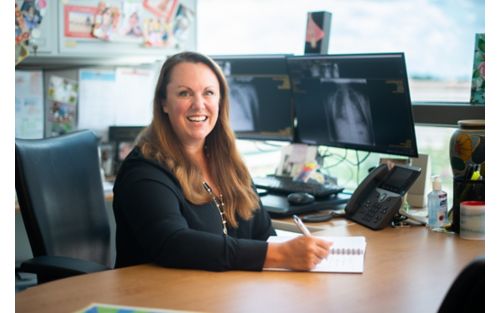 Sara Federico at desk