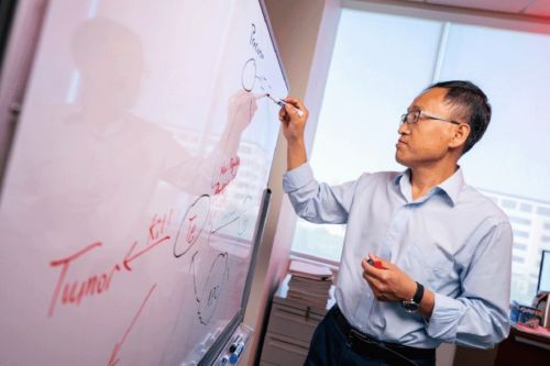 Photo of Yong Feng by a window