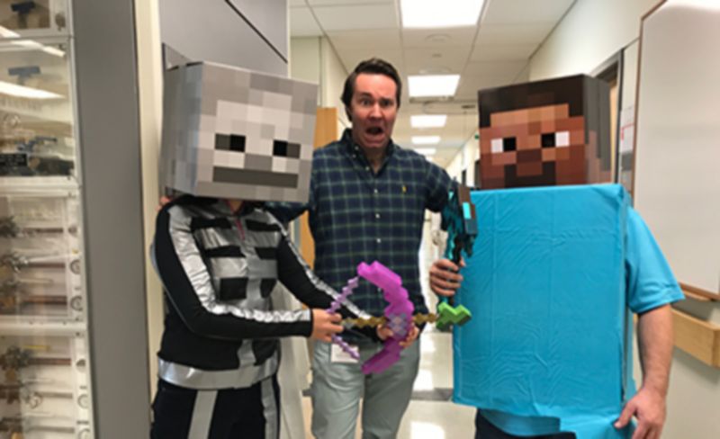 Fischer and two lab members wearing minecraft costumes
