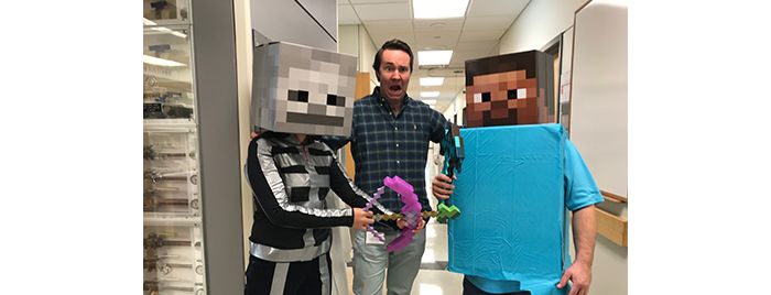 Fischer and two lab members wearing minecraft costumes