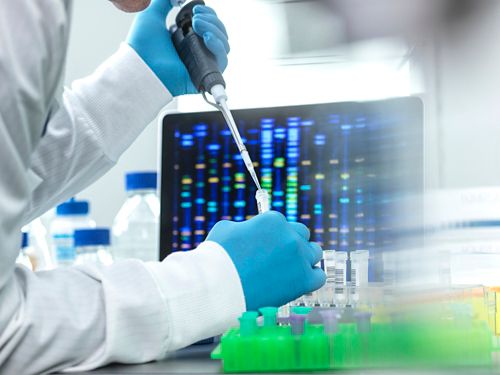 Research person in lab working with test tube