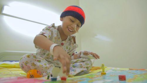 Pediatric patient playing with blocks