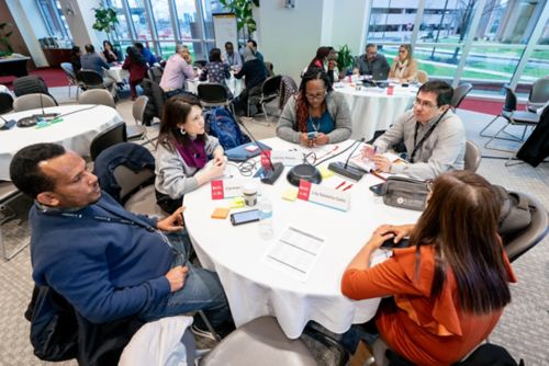 image of people sitting at a table.