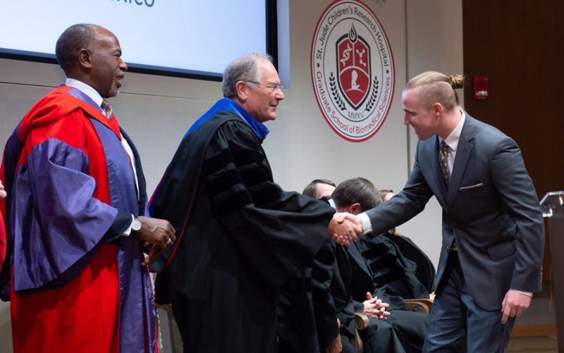 Man shaking hands down a line of people