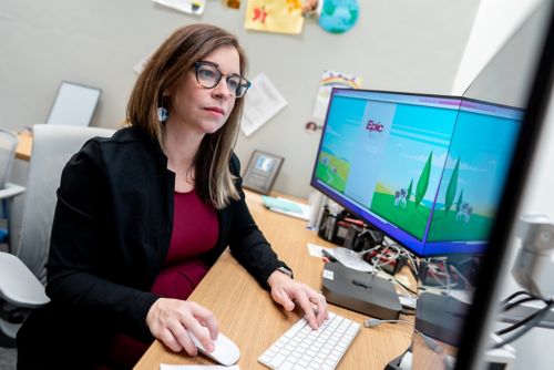 image of Dylan Graetz working at her desk.