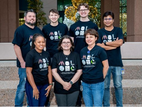 Members of the Guenther lab wearing matching t-shirts. 