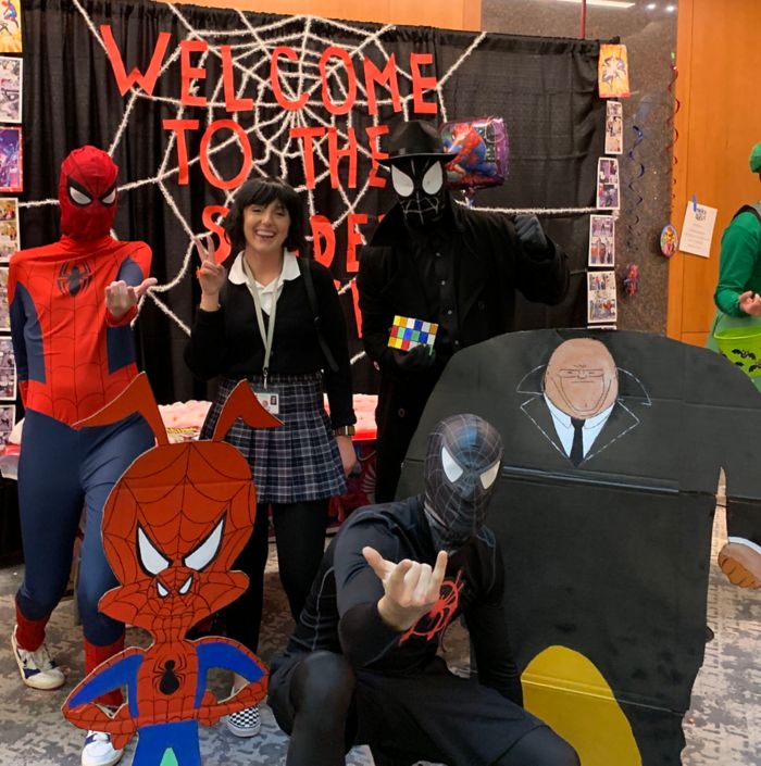 people in spiderman costumes