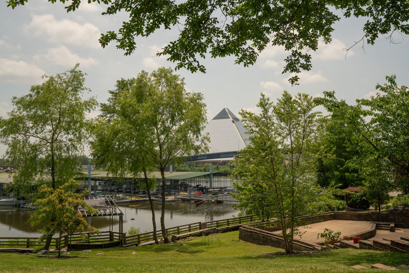 photo of the Memphis Pyramid in background with trees in foreground