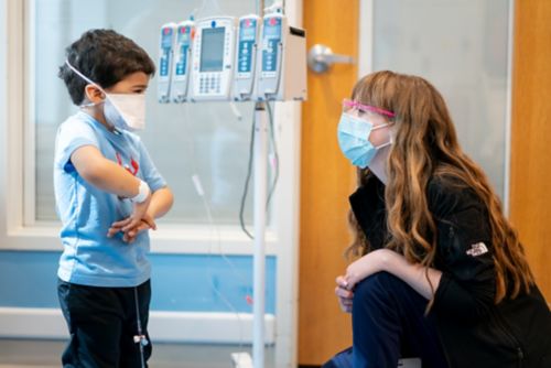 Hayley Arcenaux with Childhood Cancer Patient