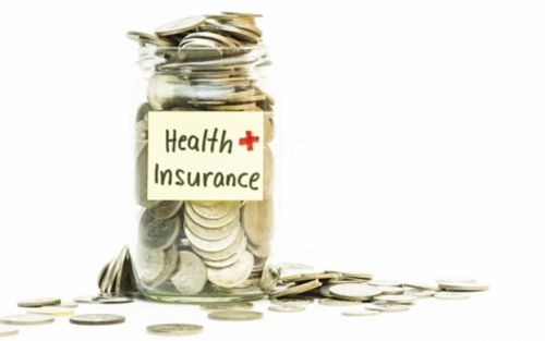 Jar with money labeled "Health  insurance"