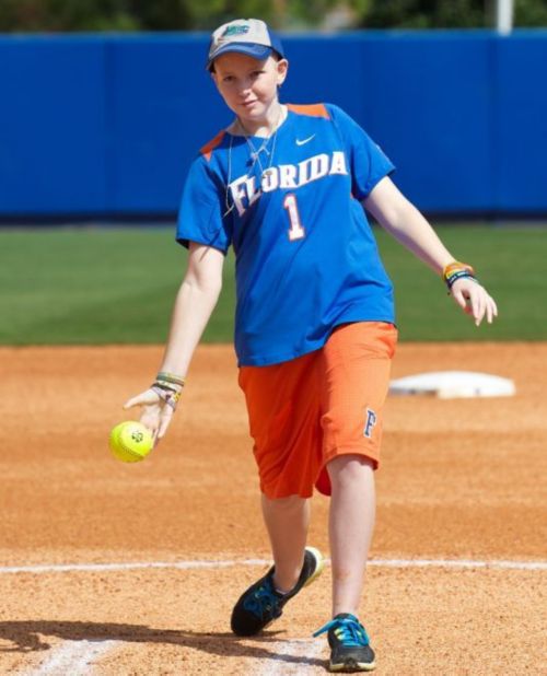 Heather playing softball