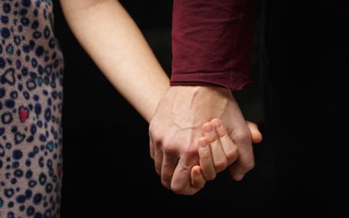 Hand holding child's hand