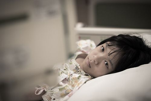 Child with fatigue from cancer and cancer treatment