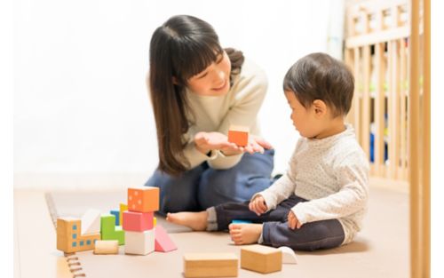 Mother playing with baby