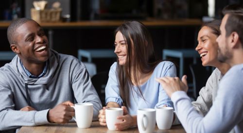 A group of people drinking coffee