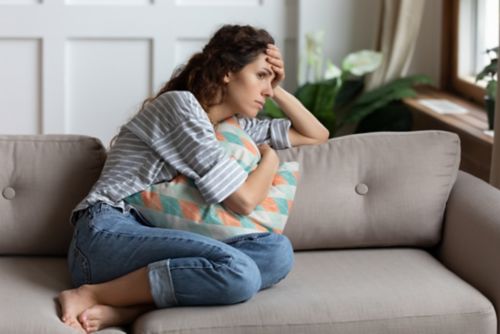 Woman is feeling stressed.